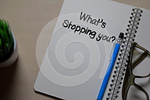 What`s Stopping You write on a book isolated on Office Desk