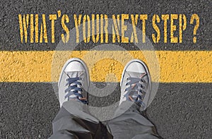 What`s your next step?, print with sneakers on asphalt road