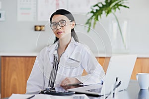 So, what seems to be the issue. Cropped portrait of a young female doctor working in her office in the hospital.