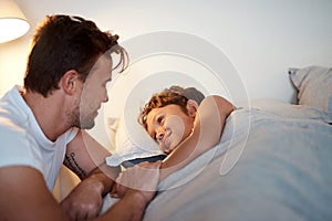 What story do you want to hear tonight. a man putting his son to bed.