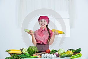 what to choose. kid having fun with food vegetables at kitchen. Child and vegetables. Healthy eating and lifestyle