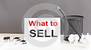 WHAT TO SELL text and office supplies, business concept