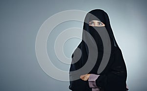 What you believe so you will achieve. Studio shot of a young muslim businesswoman against a grey background.