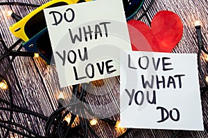 what you love, love what you do - motivational word advice or reminder on sticky notes on cork board background