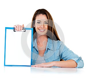 What are your personal goals. Studio portrait of an attractive young woman holding a clipboard with a blank piece of