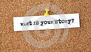 What is your story. Text written on a piece of paper, cork board background