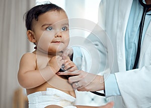 What is it that youre hearing, doc. Closeup shot of a paediatrician using a stethoscope during a babys checkup in a