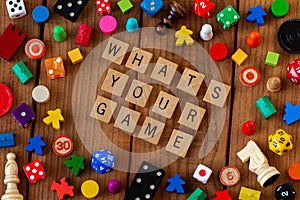 `Whats Your Game` spelled out in wooden letter tiles