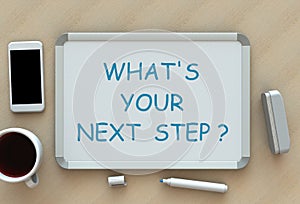 Whats Your Next Step, message on whiteboard, smart phone and coffee on table