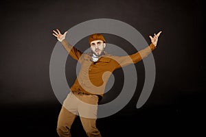 Whatsapp. Young bearded man in beige clothes on grey background