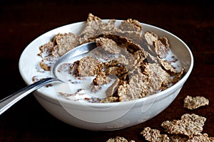 Wheat bran breakfast cereal in bowl.