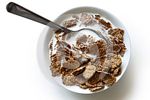 Wheat bran breakfast cereal in bowl.