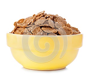 Wheat bran breakfast cereal in a bowl on white background
