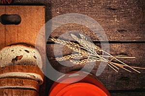 Wheat and bread on table