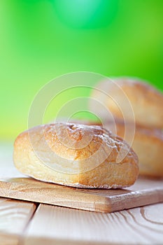 Wheat buns on breadboard