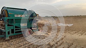 Threasure while threshing wheat crop in rural punjab