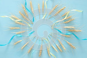 wheat crop on wooden table. Symbols of jewish holiday - Shavuot