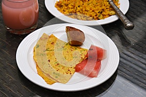 Wheat Dosa and poha with juice Indian breakfast
