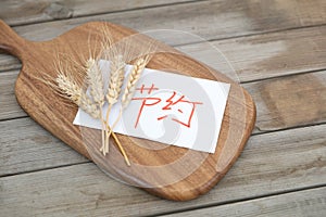 Wheat ears and a note advocating conservation are on the cutting board