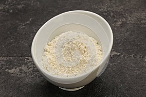 Wheat flour heap in the bowl