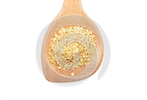 Wheat germs on wooden spoon on white background