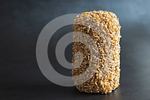 wheat grain bar closeup over dark background