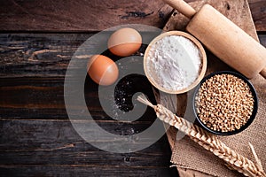 Wheat grain, flour, egg and kitchen utensil for bakery cooking