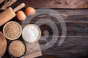 Wheat grain, flour, egg and kitchen utensil for bakery cooking