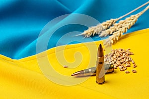 Wheat Grain in Ukraine with flag. Concept of food supply crisis and global food scarcity