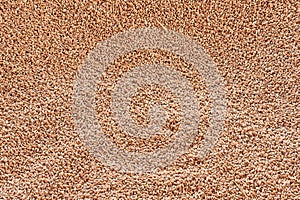 Wheat grains as agricultural background. Top view, wheat grains texture.