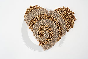 Wheat grains laid out in the shape of a heart