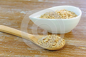 Wheat grains wooden spoon