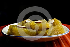 Wheat halwa garnished with badam