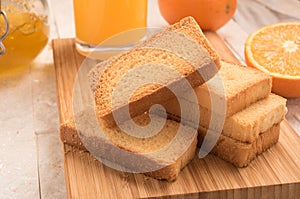Wheat rusk in a wooden panel with jam. photo