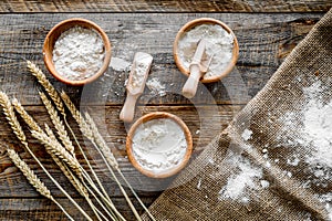 Wheat and rye ear for flour production on wooden desk background top view