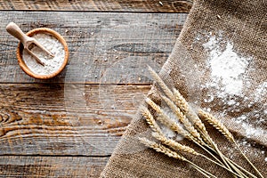 Wheat and rye ear for flour production on wooden desk background top view mockup