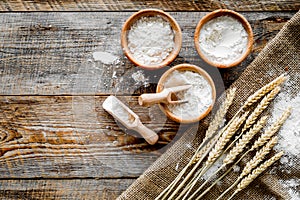 Wheat and rye ear for flour production on wooden desk background top view space for text