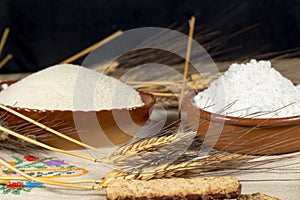 Wheat spikes surrounded by derived foods and ingredient photo