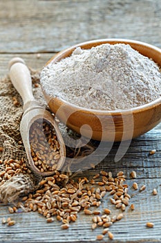 Wheat wholemeal flour in a wooden bowl.