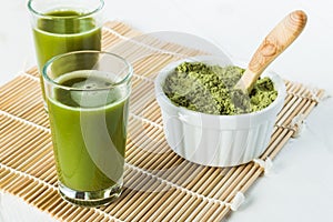 Wheatgrass juice shots in small glasses