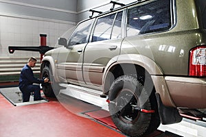 Wheel alignment for SUV in professional workshop