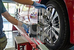 Wheel alignment of a vehicle in progress photo