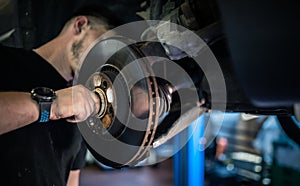 Wheel bearing repair at auto service photo