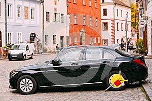 Wheel Of Car Was Locked With Yellow Clamped Wheel Lock By Traffic Police