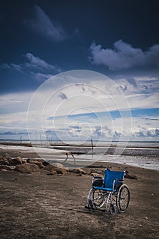 Wheel chair at the beach