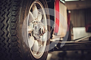 Wheel of classic car in a workshop