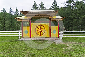 Wheel of Dharma at the gates of a Buddhist temple