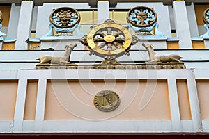 Wheel of Dharma on temple wall close