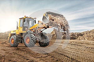 Wheel front loader bulldozer pours sand. Distributes sand for road construction. Powerful earthmoving equipment. Construction site