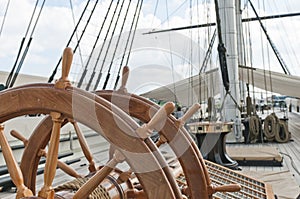 Wheel of large sailing ship photo